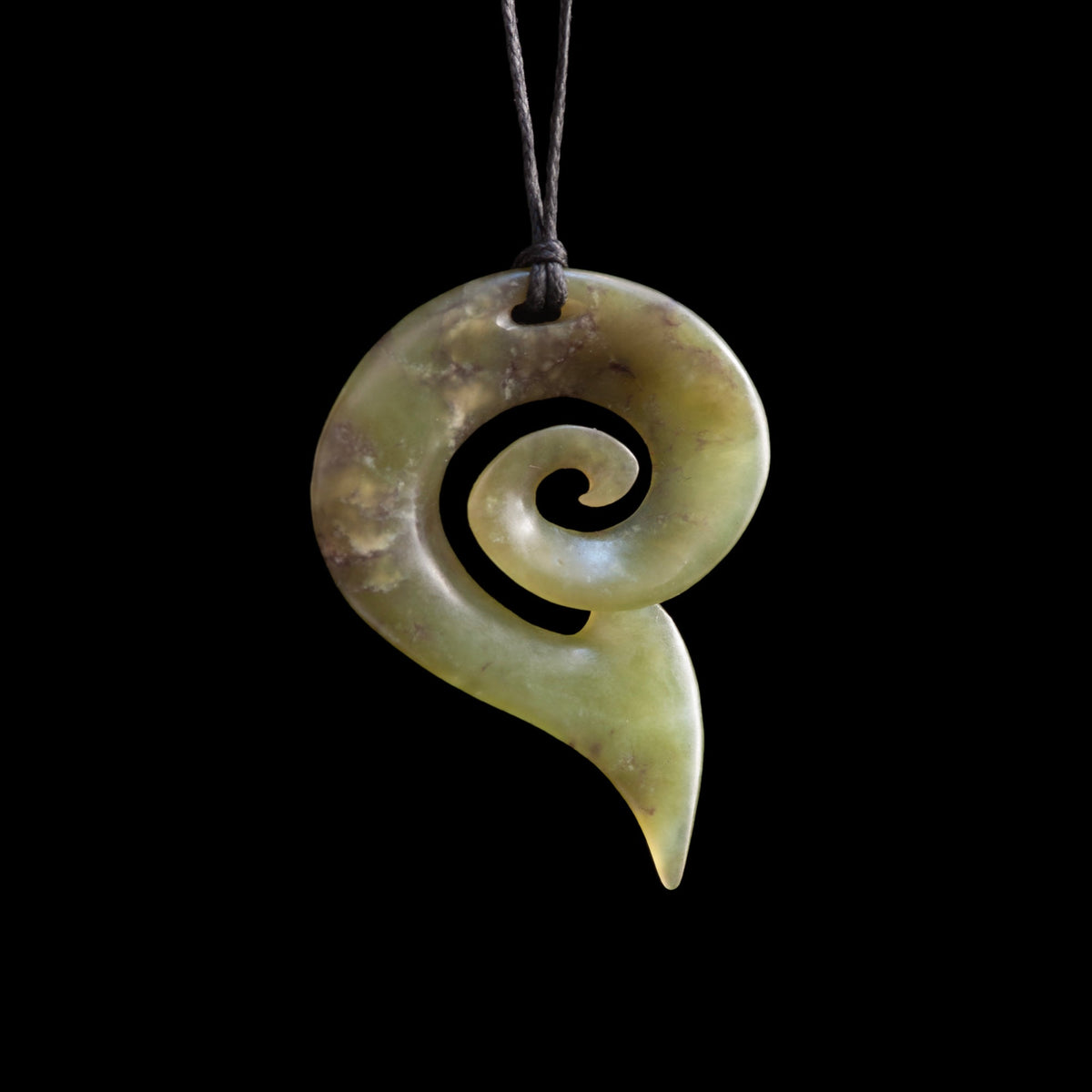 Pounamu matau with koru