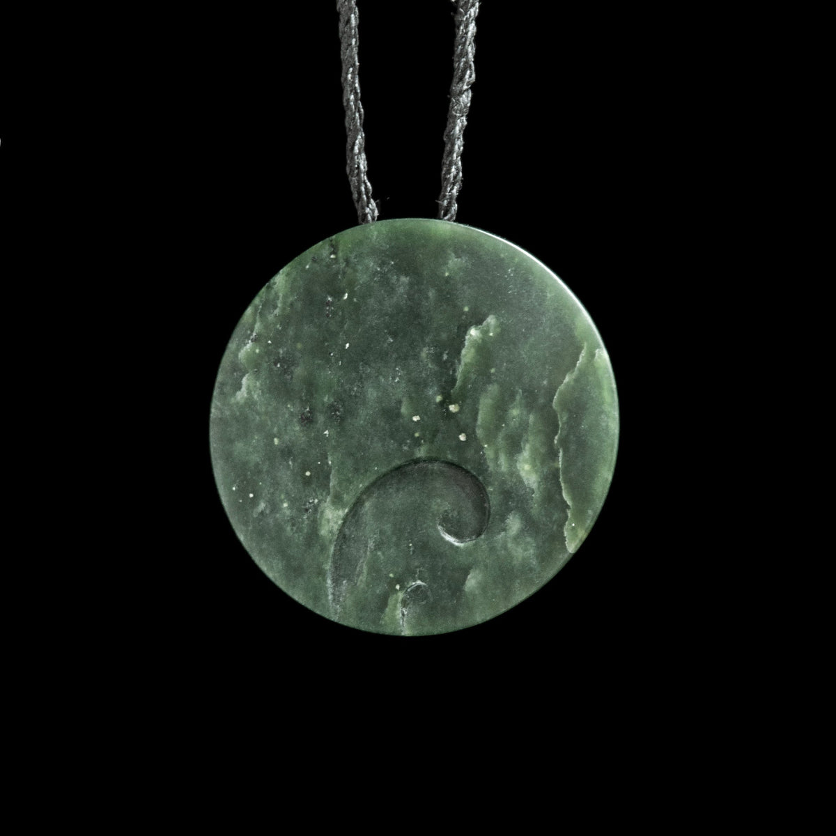 Rimu jade disc with koru